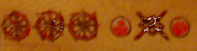 Symbols possibly representing cotton spinning on the Midgley-Cox Arms.