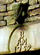 Figurehead above a small building at New Hall Farm.